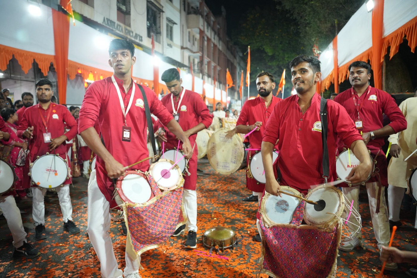 Dhol players in red uniforms